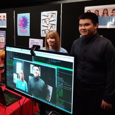 Two students demonstrate the AI glasses technology