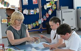 Teacher using kit box with children